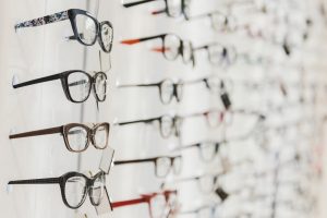 A wall of designer glasses and frames on display