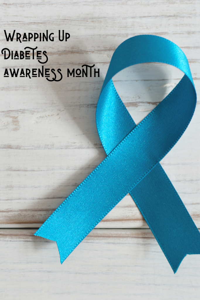 a blue ribbon with the words wrapping up diabets awareness month.