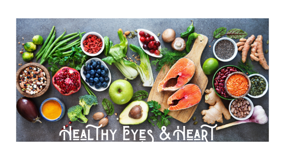 healthy eyes and heart surrounded by fruits and vegetables.