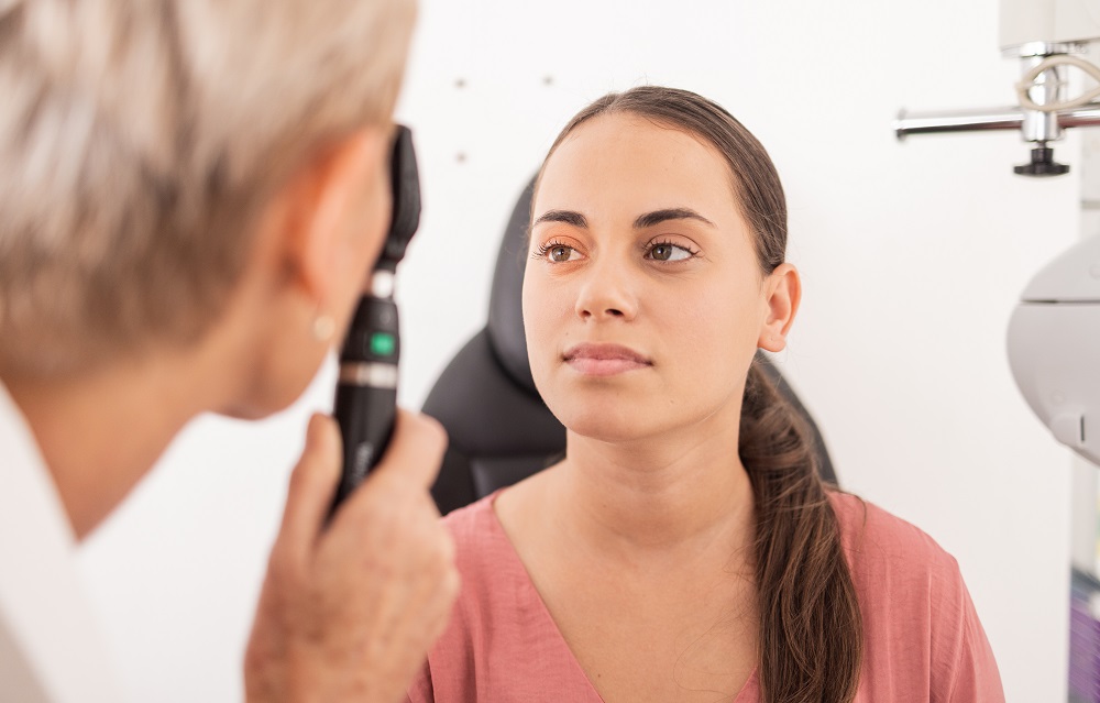 Vision eye exam, patient or woman with optometrist for glaucoma test